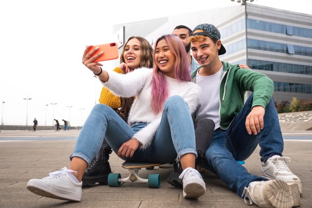 Kids in a selfie in an article on people pleasing and ADHD by Caroline Maguire.
